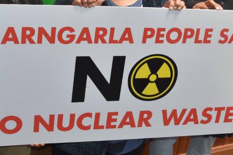 Sign that reads "Barngarla people say no to nuclear waste" with the nuclear sign inside the O of the "No"
