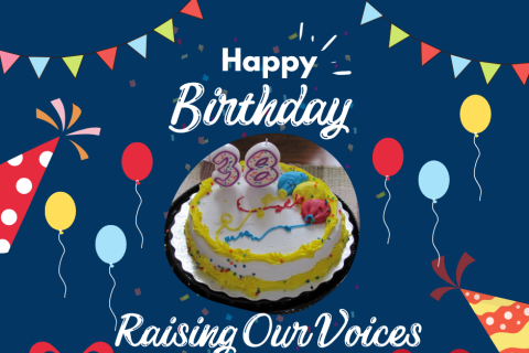 Image: A Cake saying Happy 38th Birthday Raising Our Voices! Colourful Balloons and festive party hats and streamers on a dark blue background