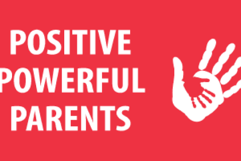 Positive Powerful Parents words on a red screen with a human hand 