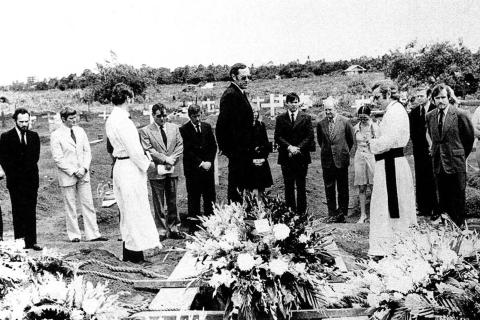 Richard Woolcott glances down into the Jakarta grave holding a single coffin containing the burnt remains of four of the five Australia-based journalists murdered seven weeks earlier by Indonesian special forces soldiers inside East Timor. It’s December 5 1975, just two days before Indonesia’s invasion of East Timor.