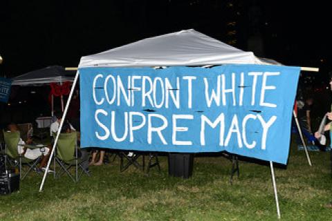 Confront white supremacy banner