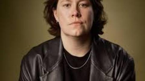 Chloe Petts black round-neck shirt black hair black leather jacket