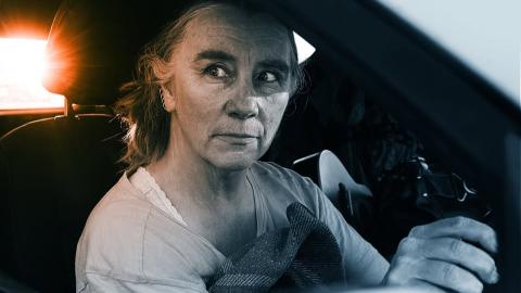 Penelope Swales at steering wheel in car