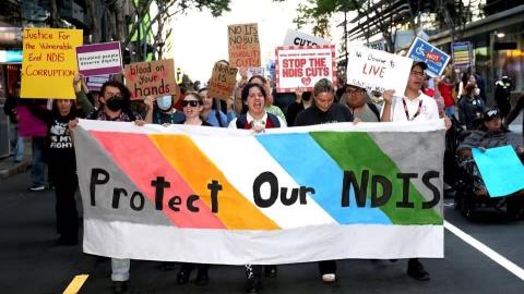 Protect Our NDIS Rally: People holding banners