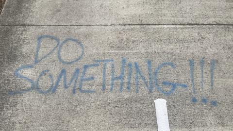 graffiti saying "do something!!!"