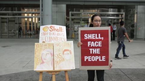 Krishna Ariola Philippines Activist outside Shell HQ.Photo Credit Greenpeace