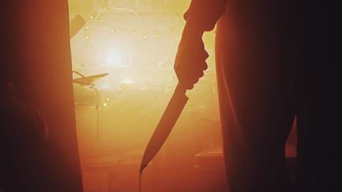 Photo of a horror movie scene, person with knife